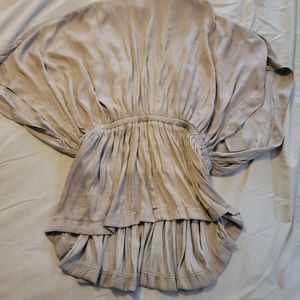 Flowy blouse with cinch waist.